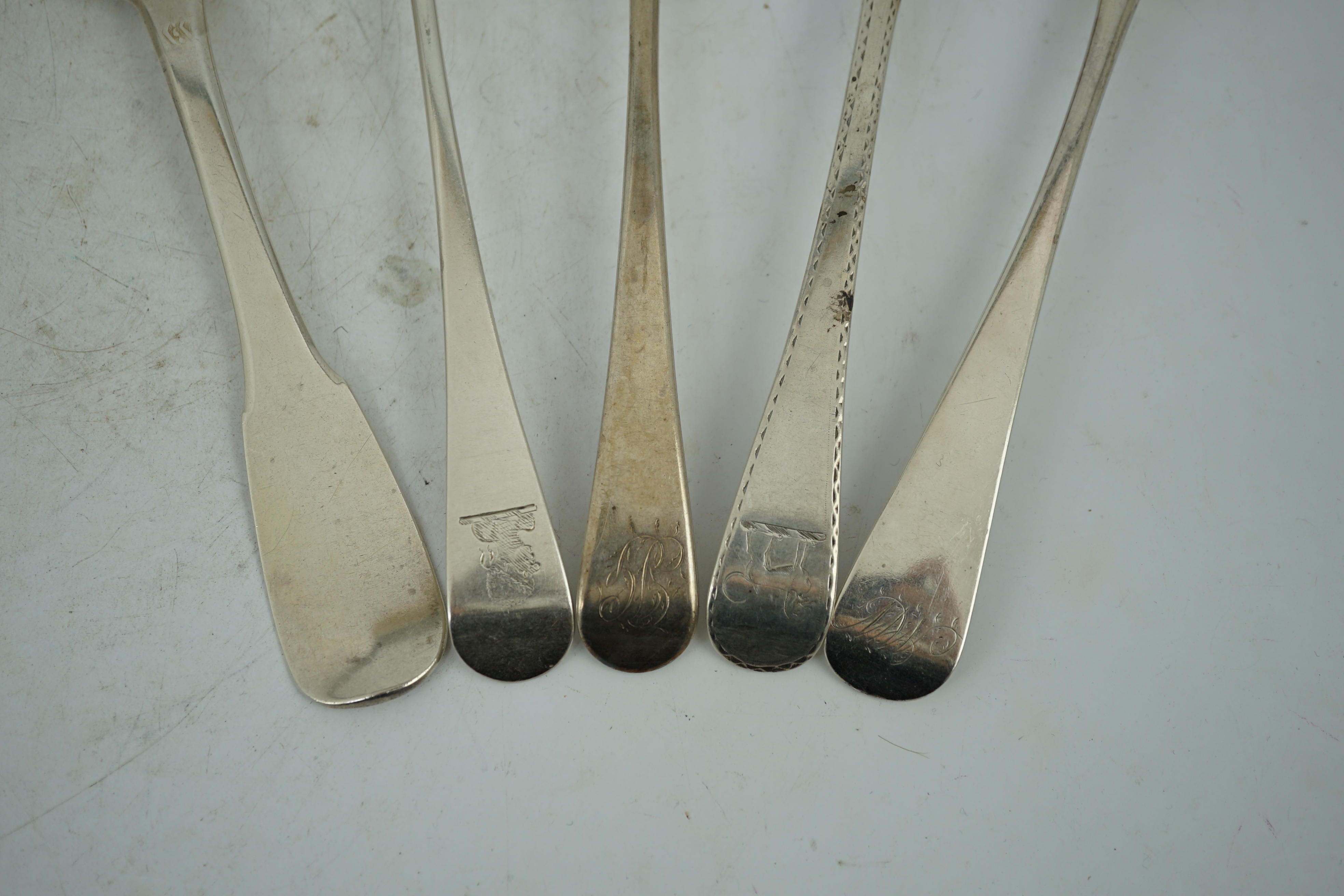 A harlequin collection of 18th and mainly 19th century silver Old English pattern table spoons, various dates and makers, forty five items, together with five similar fiddle pattern table spoons and two French white meta